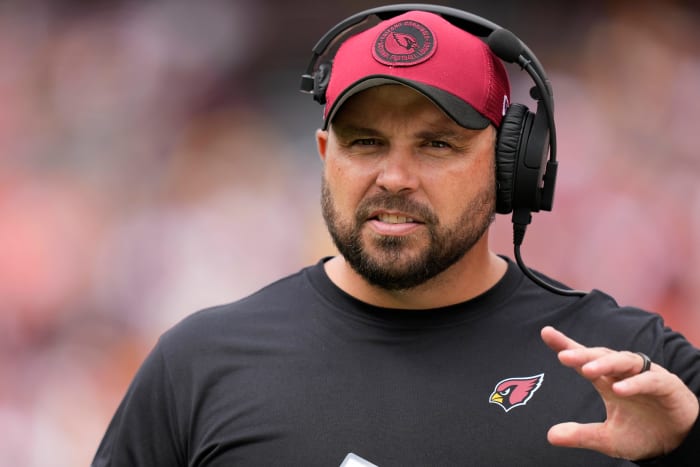 Cardinals offensive line coach Klayton Adams walks on the sideline before the game against the Commanders.